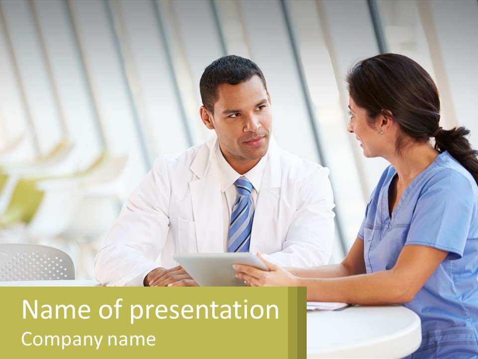 A Man And A Woman Sitting At A Table With A Tablet PowerPoint Template