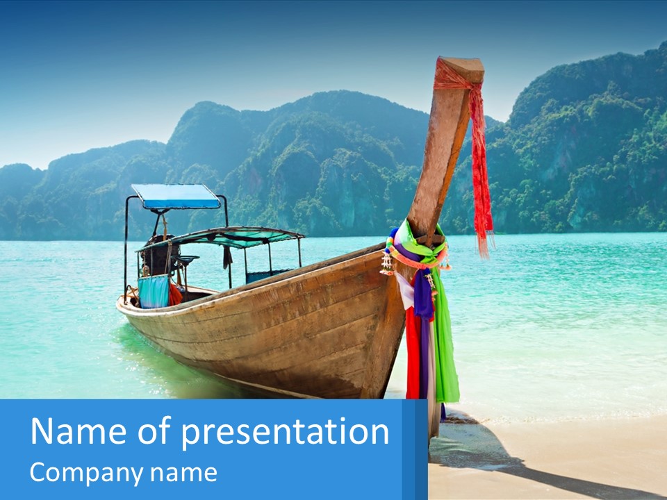 A Boat On The Beach With Mountains In The Background PowerPoint Template