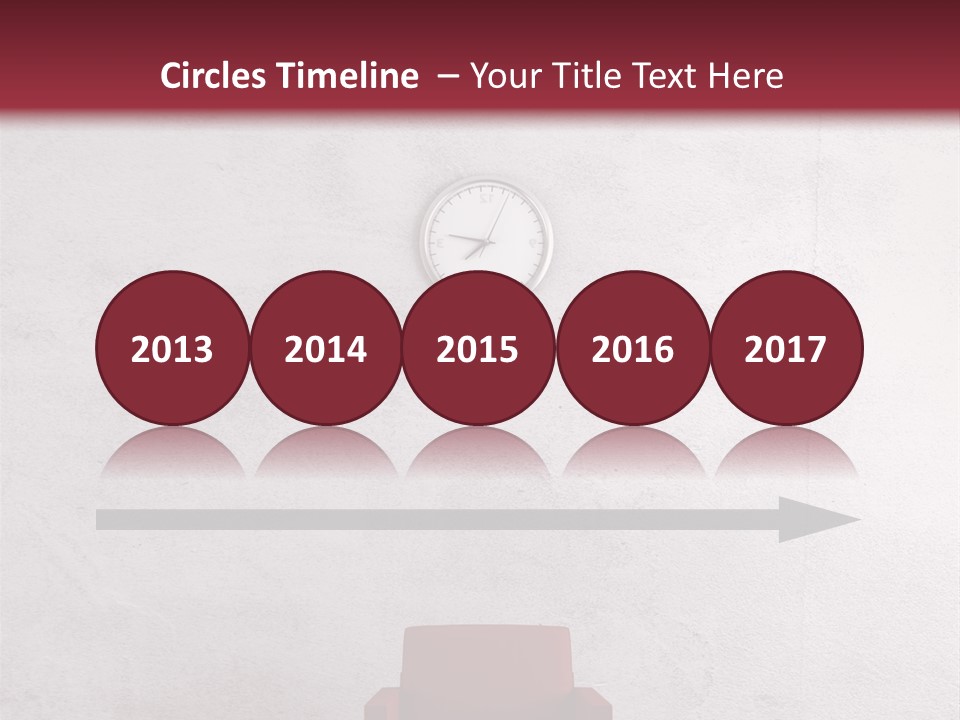 A Red Chair In A Room With A Clock On The Wall PowerPoint Template