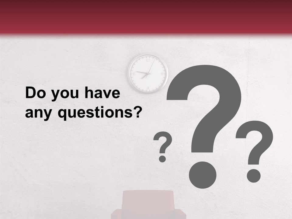 A Red Chair In A Room With A Clock On The Wall PowerPoint Template