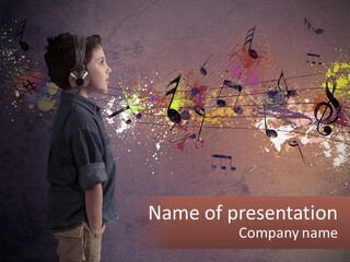 A Young Boy Listening To Music With Headphones On PowerPoint Template