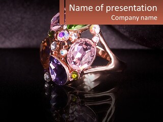 A Ring With A Bunch Of Different Colored Stones On It PowerPoint Template