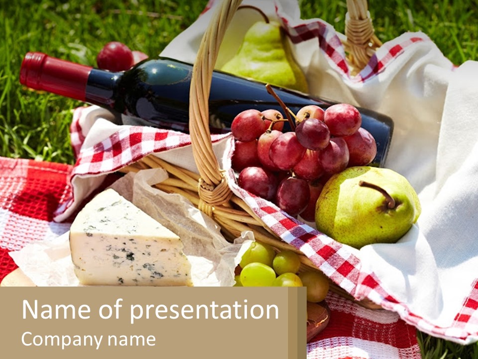 A Picnic Basket Filled With Fruit And Cheese PowerPoint Template
