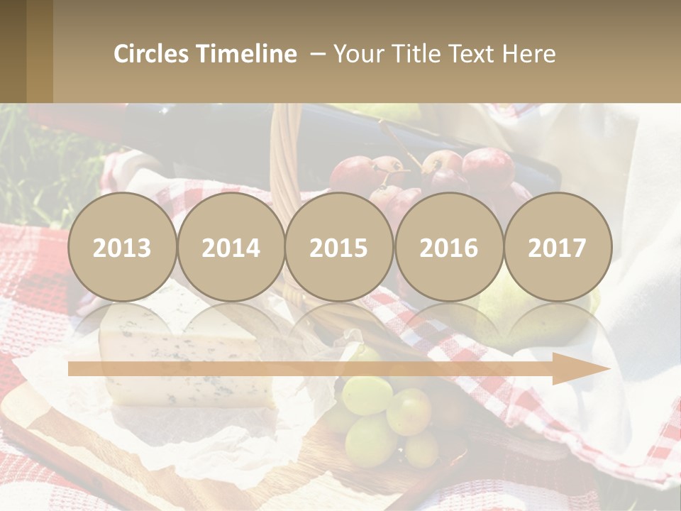 A Picnic Basket Filled With Fruit And Cheese PowerPoint Template