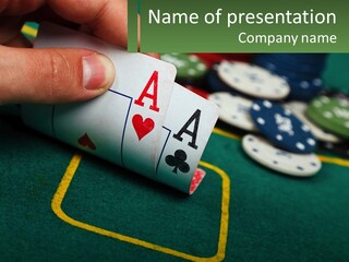 A Hand Holding A Playing Card Over A Casino Table PowerPoint Template