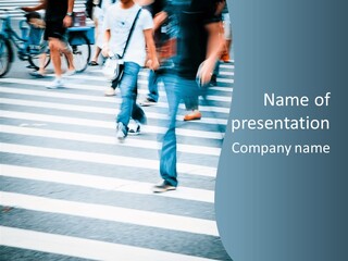 A Group Of People Walking Across A Cross Walk PowerPoint Template