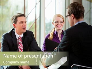 A Group Of People Sitting Around A Table Shaking Hands PowerPoint Template