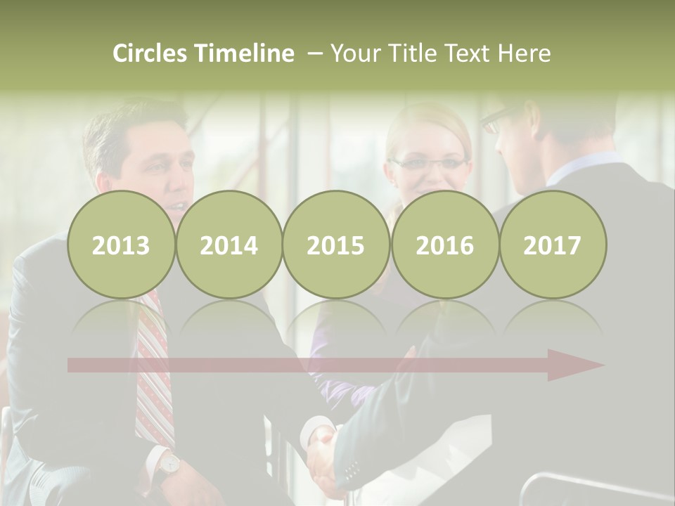 A Group Of People Sitting Around A Table Shaking Hands PowerPoint Template