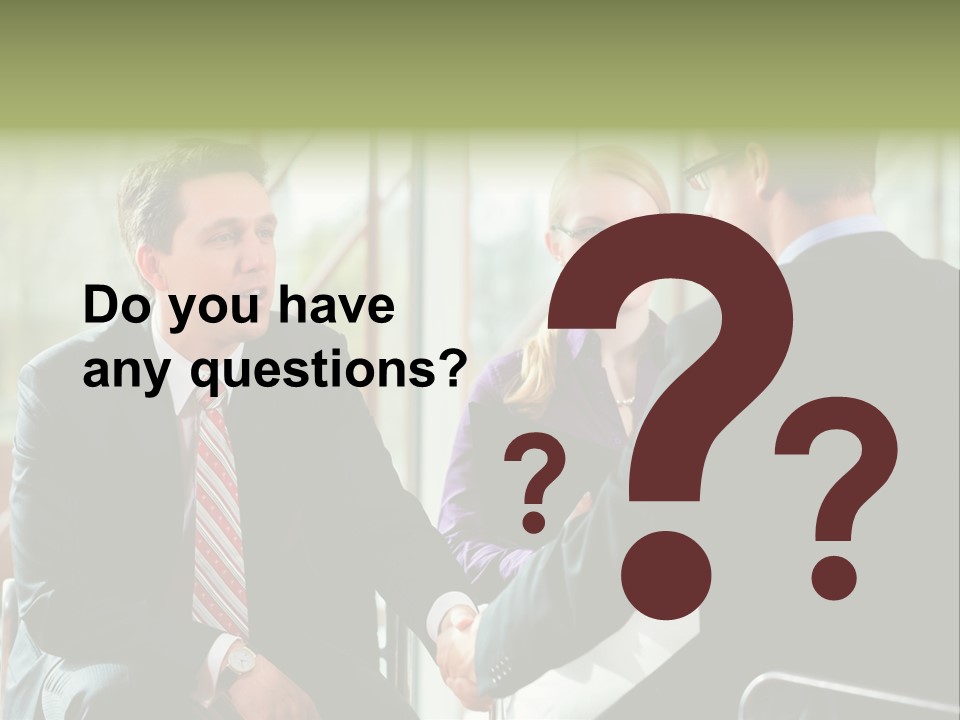 A Group Of People Sitting Around A Table Shaking Hands PowerPoint Template