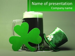 A Glass Of Beer With A Shamrock Next To It PowerPoint Template