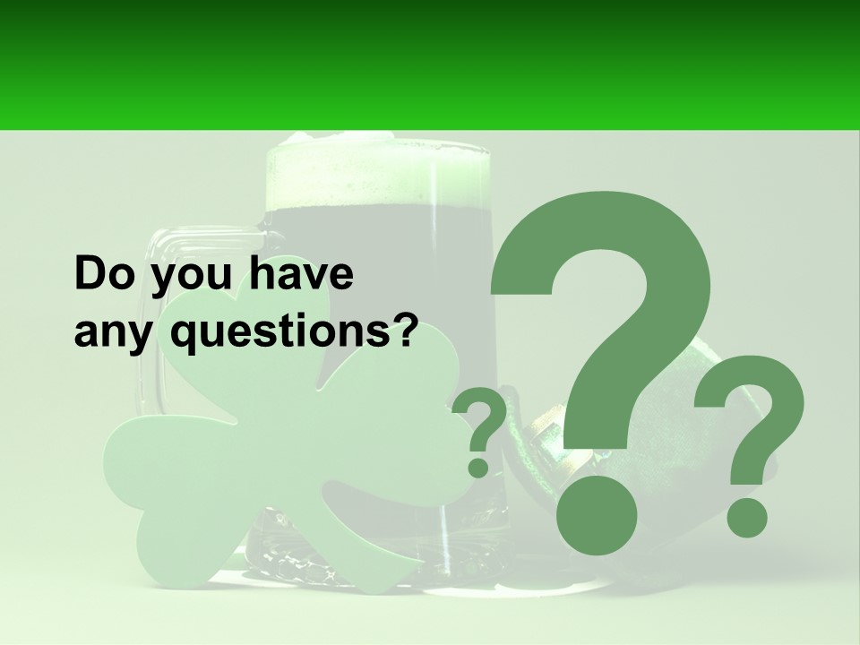 A Glass Of Beer With A Shamrock Next To It PowerPoint Template