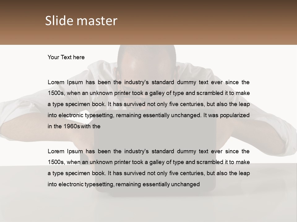 A Man Sitting In Front Of A Laptop Computer PowerPoint Template