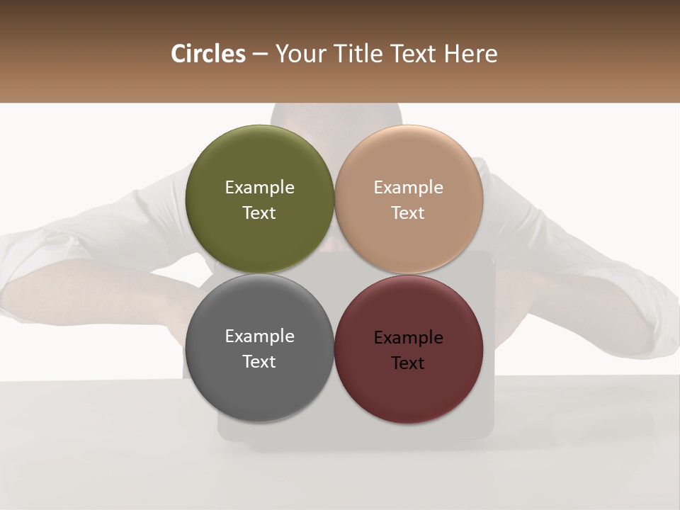 A Man Sitting In Front Of A Laptop Computer PowerPoint Template