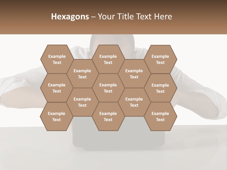 A Man Sitting In Front Of A Laptop Computer PowerPoint Template
