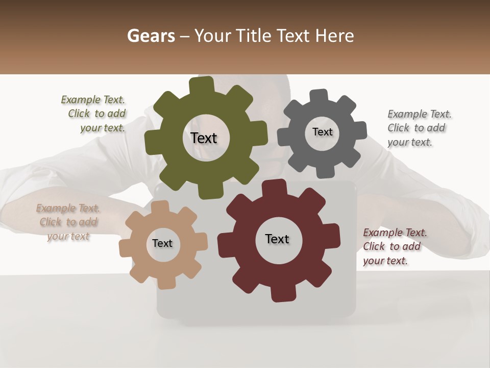 A Man Sitting In Front Of A Laptop Computer PowerPoint Template