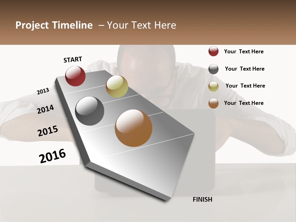 A Man Sitting In Front Of A Laptop Computer PowerPoint Template