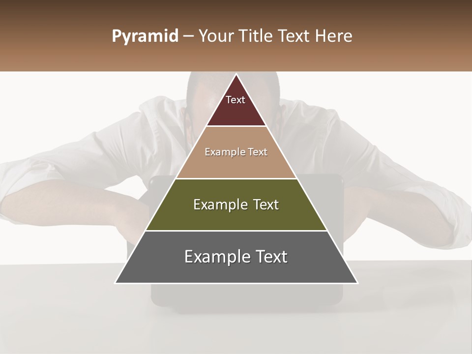 A Man Sitting In Front Of A Laptop Computer PowerPoint Template