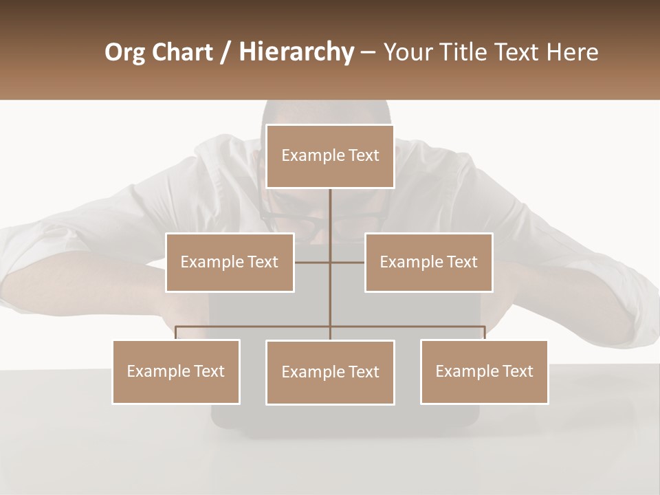 A Man Sitting In Front Of A Laptop Computer PowerPoint Template
