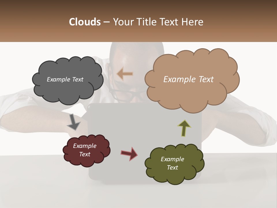 A Man Sitting In Front Of A Laptop Computer PowerPoint Template