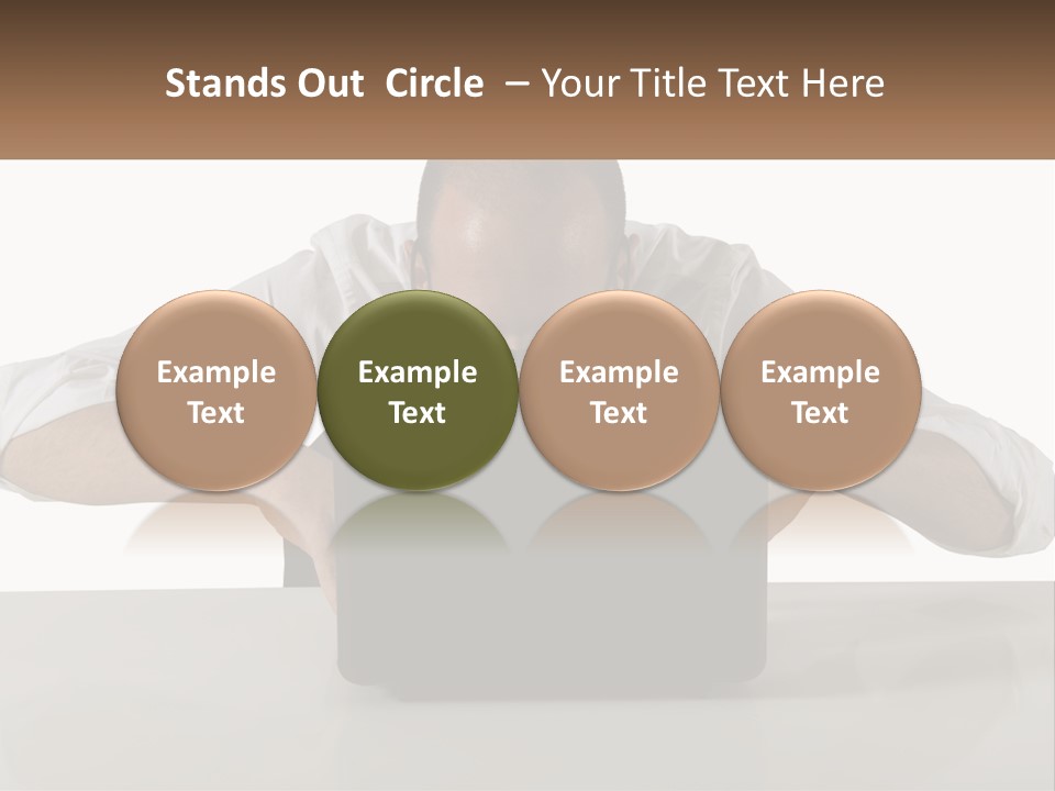 A Man Sitting In Front Of A Laptop Computer PowerPoint Template