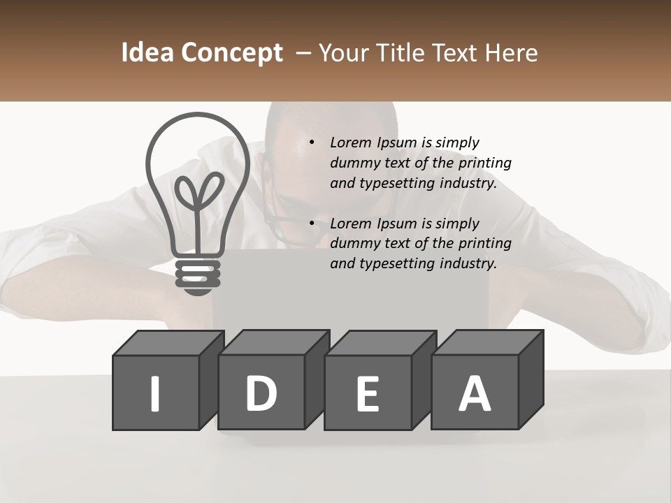 A Man Sitting In Front Of A Laptop Computer PowerPoint Template