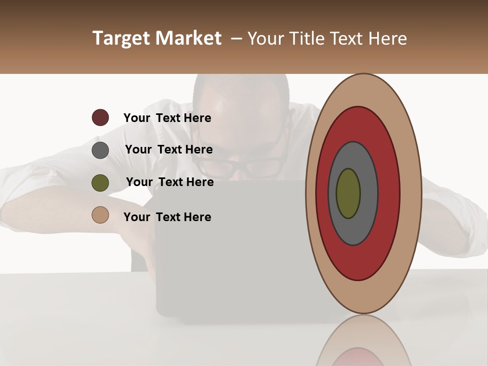 A Man Sitting In Front Of A Laptop Computer PowerPoint Template