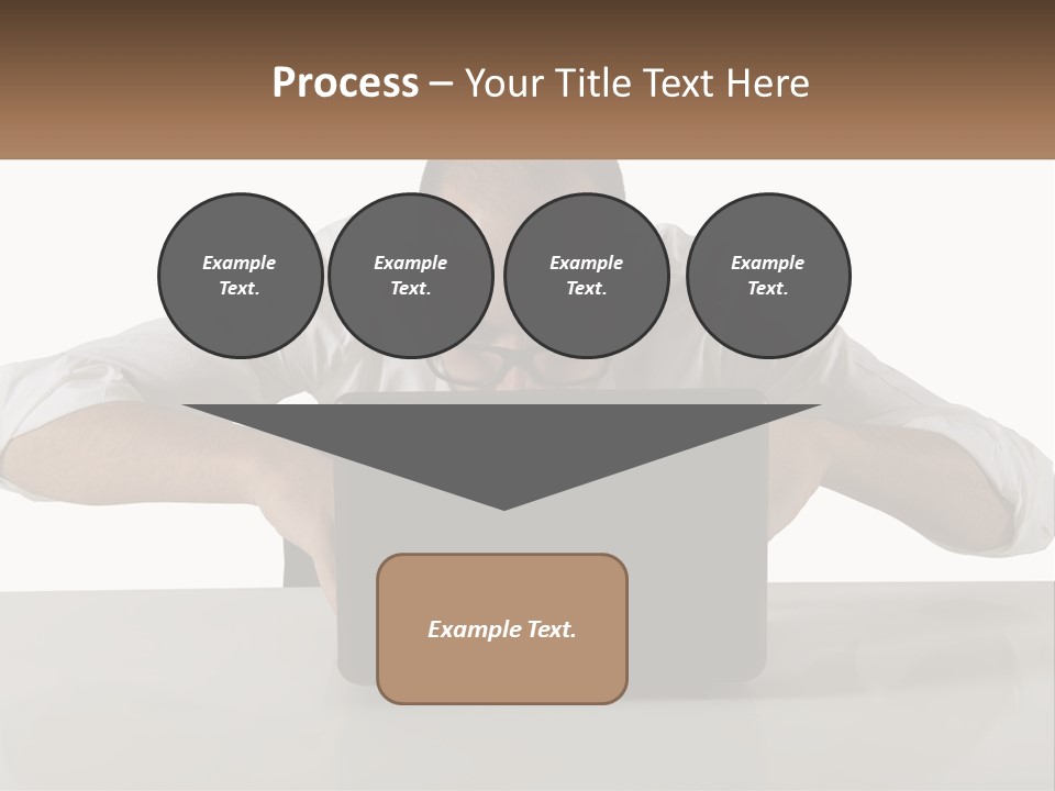 A Man Sitting In Front Of A Laptop Computer PowerPoint Template