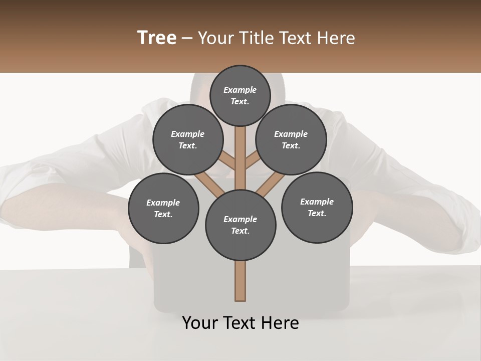 A Man Sitting In Front Of A Laptop Computer PowerPoint Template