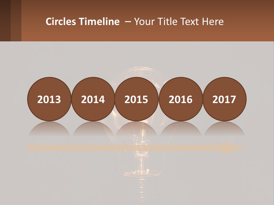 A Light Bulb On Top Of A Wooden Table PowerPoint Template