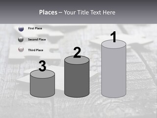A Group Of Pieces Of A Puzzle On A Wooden Table PowerPoint Template