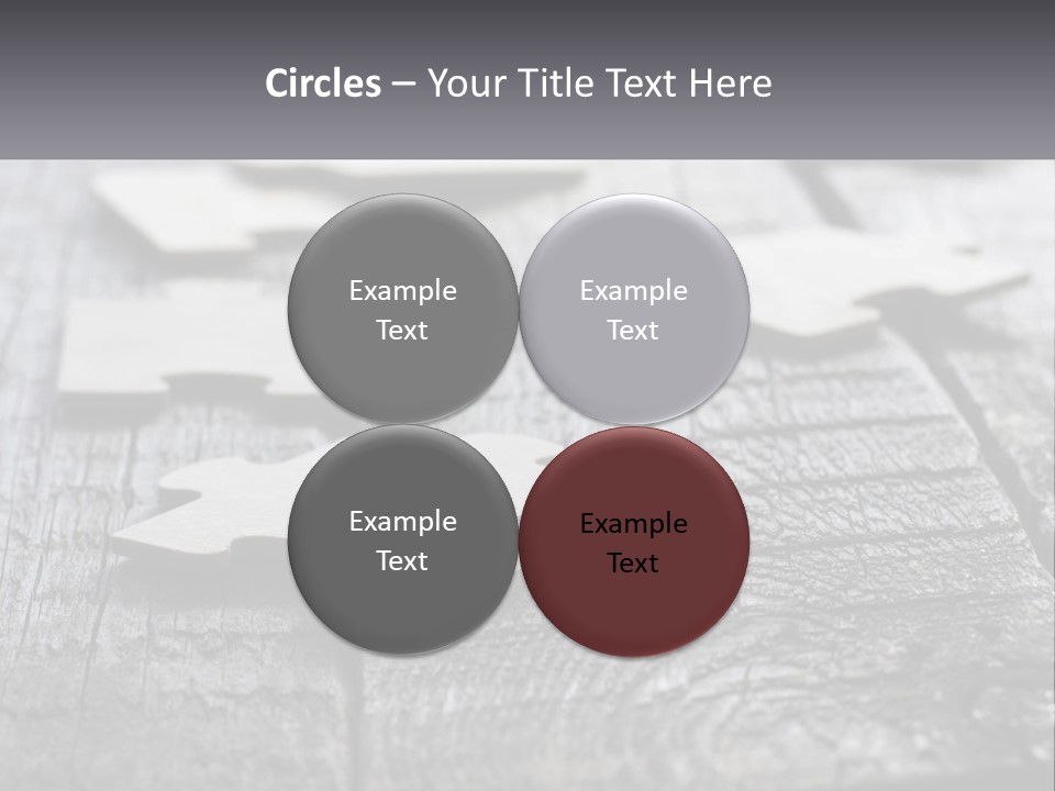 A Group Of Pieces Of A Puzzle On A Wooden Table PowerPoint Template