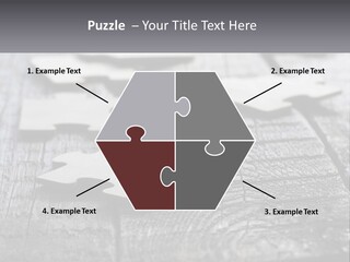 A Group Of Pieces Of A Puzzle On A Wooden Table PowerPoint Template