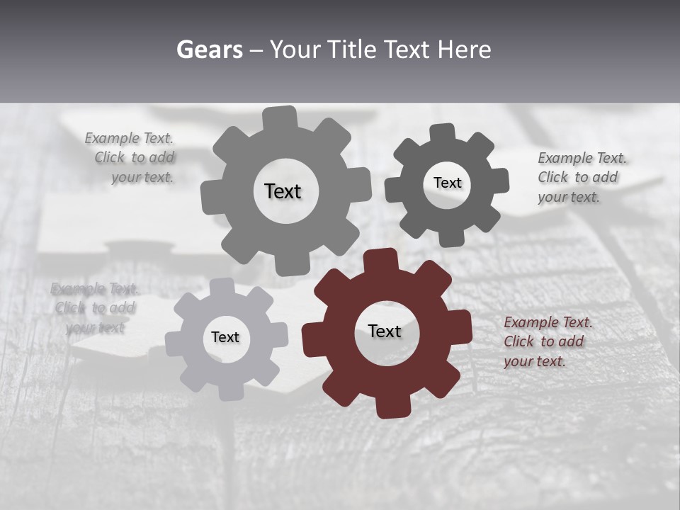 A Group Of Pieces Of A Puzzle On A Wooden Table PowerPoint Template