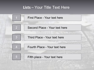 A Group Of Pieces Of A Puzzle On A Wooden Table PowerPoint Template