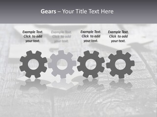 A Group Of Pieces Of A Puzzle On A Wooden Table PowerPoint Template