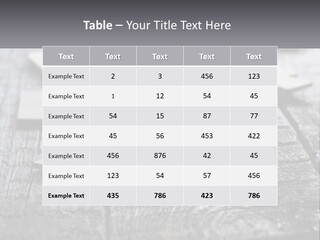 A Group Of Pieces Of A Puzzle On A Wooden Table PowerPoint Template