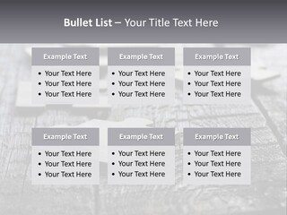 A Group Of Pieces Of A Puzzle On A Wooden Table PowerPoint Template