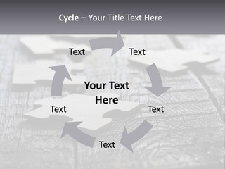 A Group Of Pieces Of A Puzzle On A Wooden Table PowerPoint Template