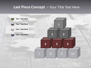 A Group Of Pieces Of A Puzzle On A Wooden Table PowerPoint Template