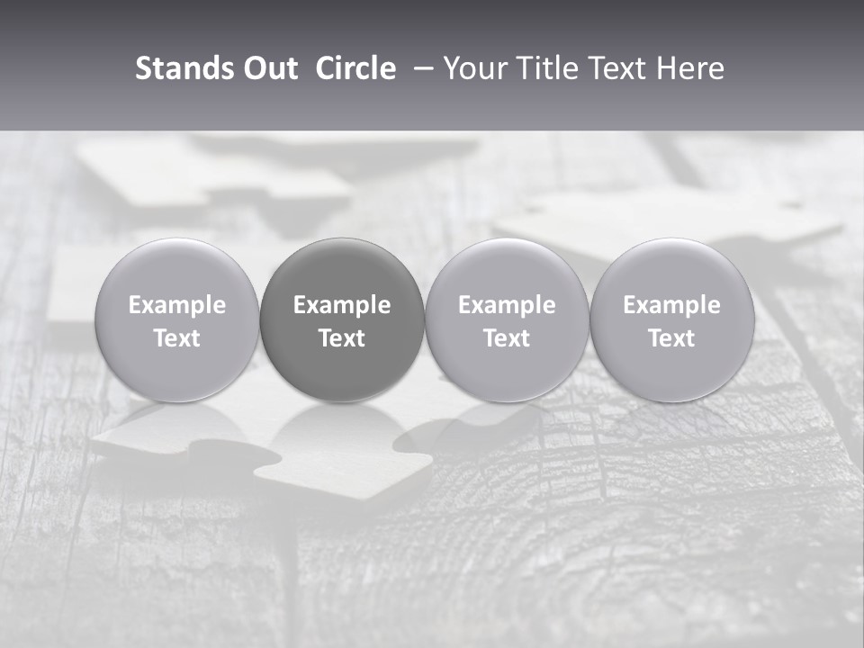 A Group Of Pieces Of A Puzzle On A Wooden Table PowerPoint Template