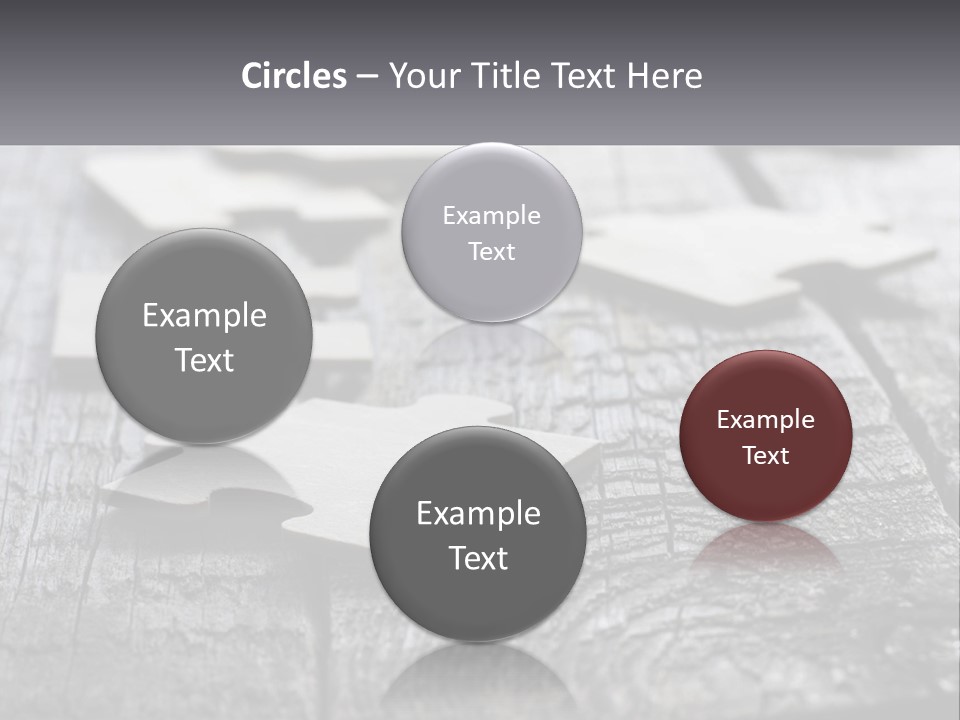A Group Of Pieces Of A Puzzle On A Wooden Table PowerPoint Template