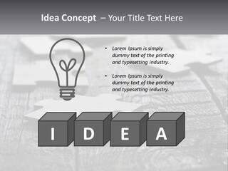 A Group Of Pieces Of A Puzzle On A Wooden Table PowerPoint Template