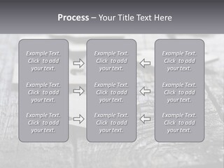 A Group Of Pieces Of A Puzzle On A Wooden Table PowerPoint Template