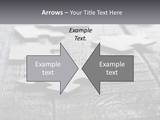 A Group Of Pieces Of A Puzzle On A Wooden Table PowerPoint Template