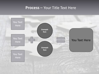 A Group Of Pieces Of A Puzzle On A Wooden Table PowerPoint Template