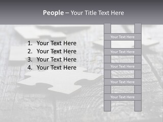 A Group Of Pieces Of A Puzzle On A Wooden Table PowerPoint Template