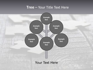 A Group Of Pieces Of A Puzzle On A Wooden Table PowerPoint Template