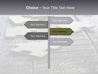 A Group Of Pieces Of A Puzzle On A Wooden Table PowerPoint Template