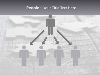 A Group Of Pieces Of A Puzzle On A Wooden Table PowerPoint Template