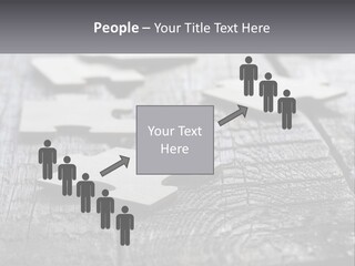 A Group Of Pieces Of A Puzzle On A Wooden Table PowerPoint Template